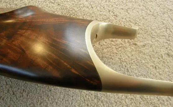 Figured walnut grip and steel grip cap