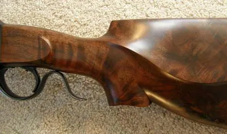 Walnut stock wrist with trigger guard