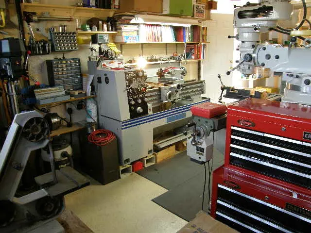 Shop interior with lathe, drill press and tool chests